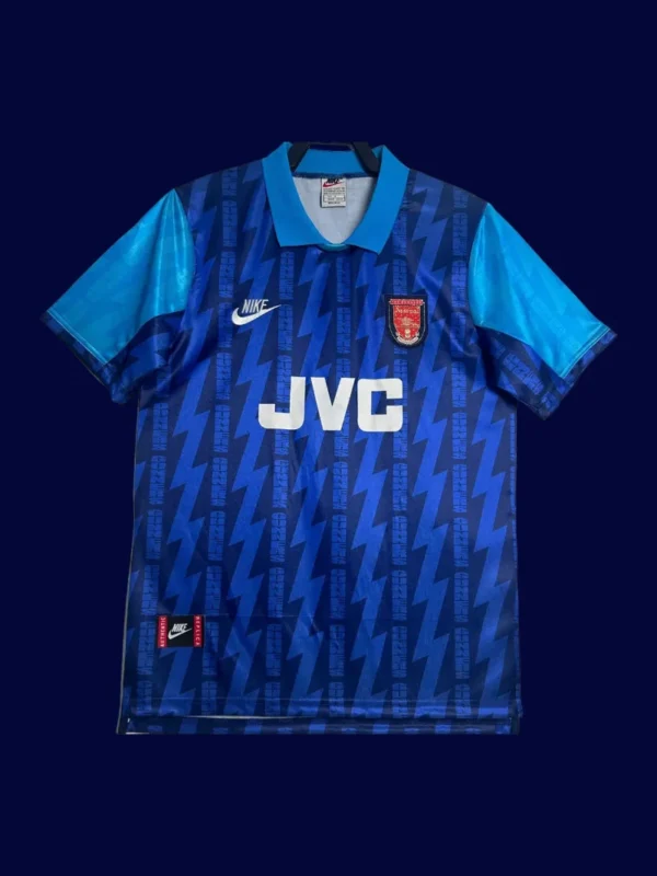 front view of blue away retro football jersey (94/95) with classic styling and vintage collar.