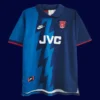front view of blue away retro football jersey (95/96) with retro collar and stripe accents.