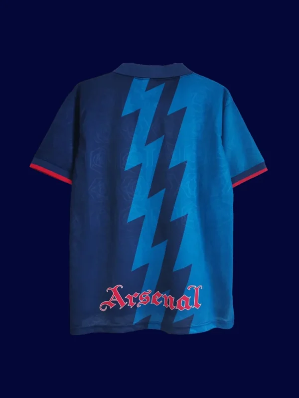 back view of blue away retro football jersey (95/96) showing reinforced number area and plain back.