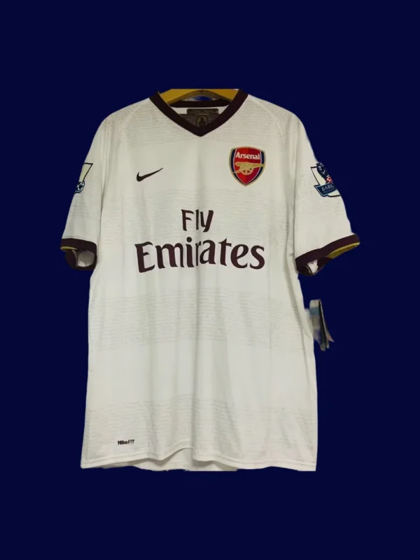front view of white away retro football jersey (07/08) with subtle stripes and fitted cut.