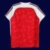 back view of red home retro football jersey (90/92) showing reinforced back panel and number zone.