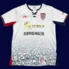 Cagliari Away Jersey 2526 Fans Version1 - KFCool – Football Jerseys & Soccer Kits Store Cagliari Away Jersey 25/26 Fans Version front with away design and club badge.