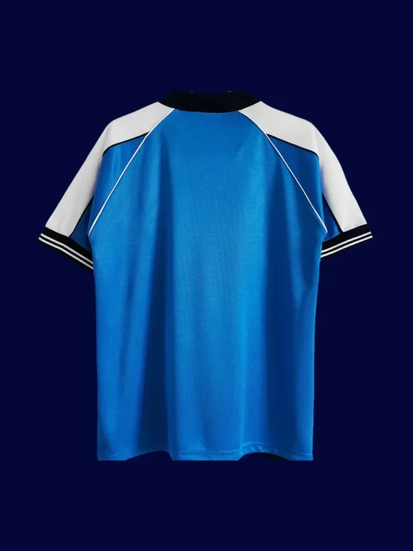 back view of Manchester City home blue retro jersey (99/01) showing stitched back panel.