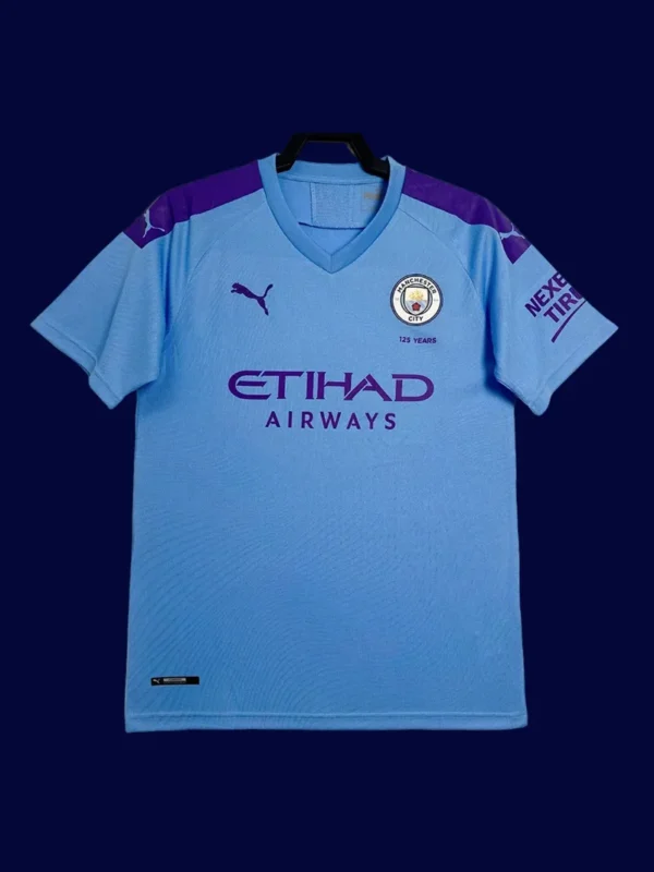 front view of Manchester City home blue retro shirt (19/20) in modern cut with vintage styling.