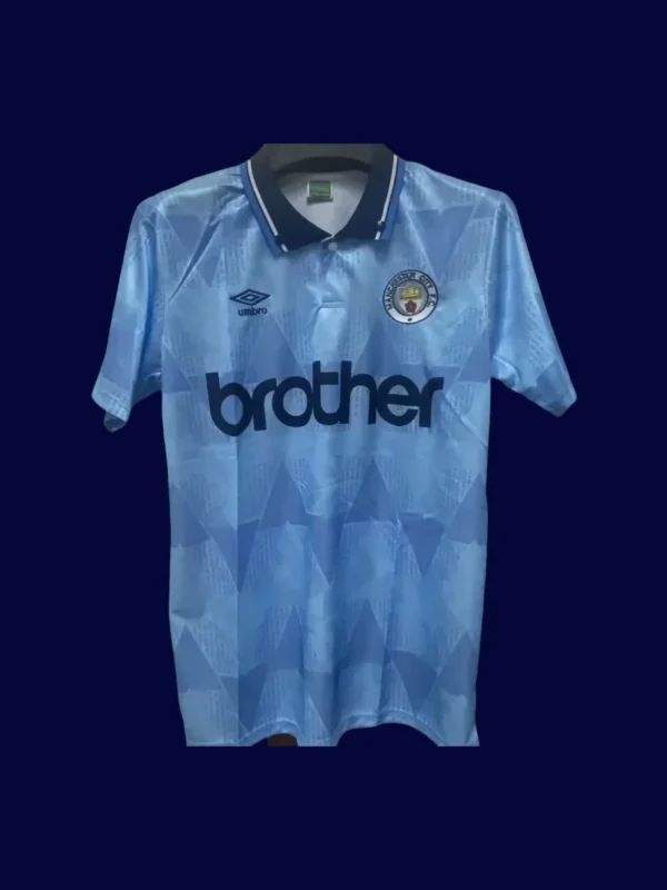 Manchester City Home Blue Retro shirt 1989A - KFCool – Football Jerseys & Soccer Kits Store front view of Manchester City home blue retro shirt (1989) with classic collar.