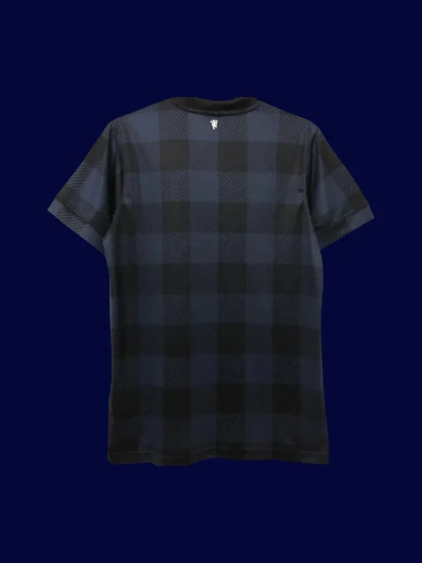 back view of away black retro jersey (13/14) showing number-ready panel.