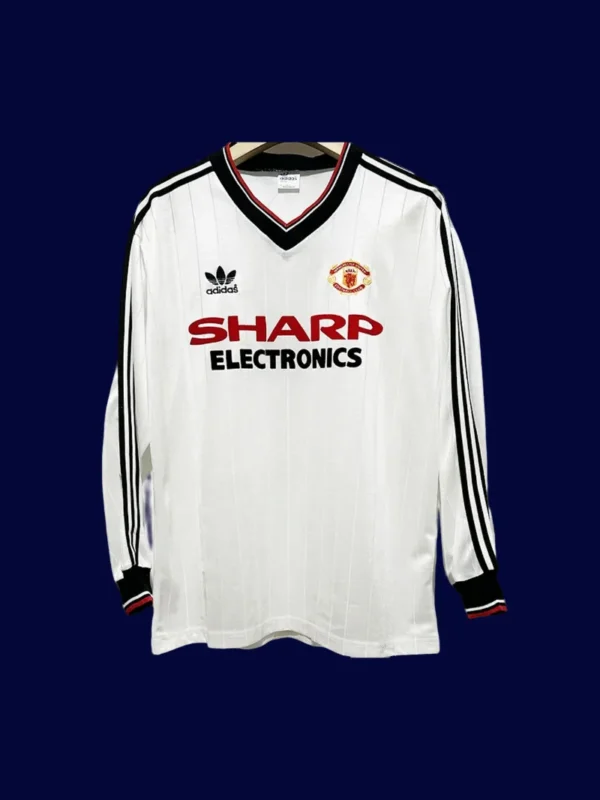front view of Manchester United away retro long sleeve jersey (82/83) in white with classic cuffs.