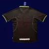 back view of UCL away black retro jersey (98/99) showing number-ready panel and stitched seams.