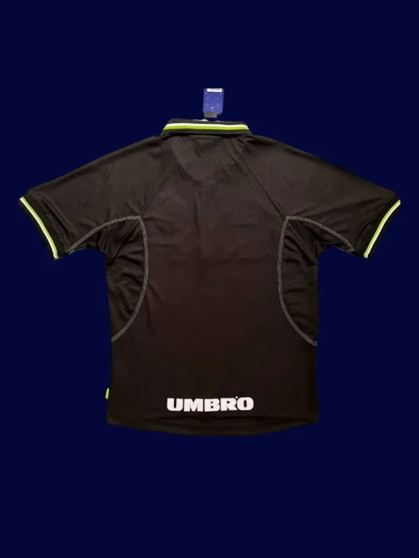 back view of UCL away black retro jersey (98/99) showing number-ready panel and stitched seams.