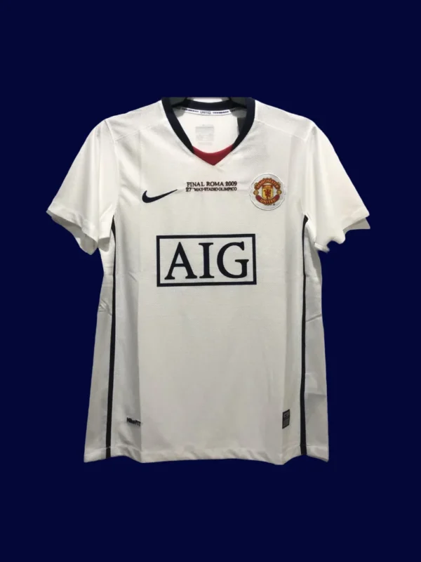 front view of Manchester United away UCL retro jersey (08/09) in blue with UEFA badges.