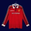 Manchester United Home Long Sleeve Retro Jersey 9899A - KFCool – Football Jerseys & Soccer Kits Store front view of Manchester United home long sleeve retro jersey (98/99) in red.