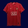 front view of Manchester United home red retro jersey (07/08) with classic V-neck and subtle trims.