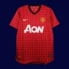 front view of Manchester United home red retro jersey (12/13) with classic collar.
