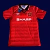 front view of Manchester United home red retro jersey (94/96) with traditional collar.