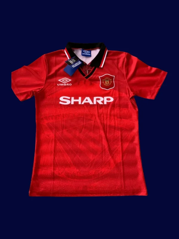 front view of Manchester United home red retro jersey (94/96) with traditional collar.