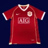 front view of Manchester United home retro jersey (06/07) in red with classic crew neck.