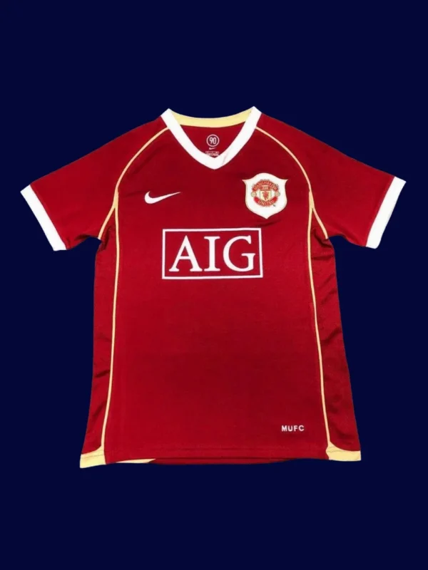 front view of Manchester United home retro jersey (06/07) in red with classic crew neck.