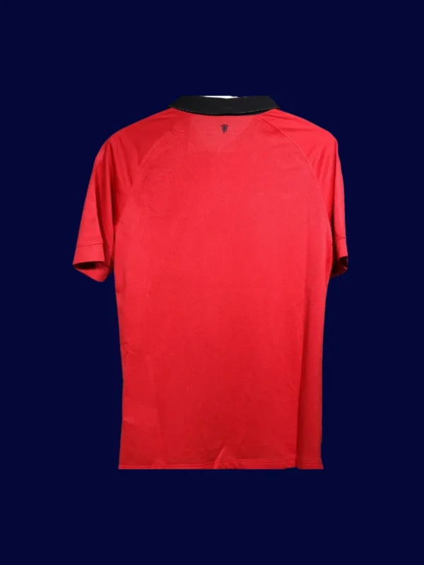 back view of player-fit home retro jersey (13/14) showing tapered back and number-ready panel.