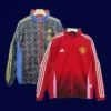 front view of Manchester United reversible windbreaker (2025) showing patterned side.