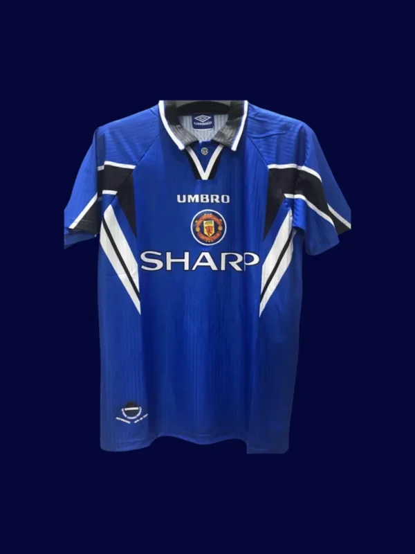 front view of Manchester United third blue retro jersey (96/98) with crew neck and retro trims.