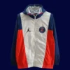 PSG Jordan white orange windbreaker 25/26 front view