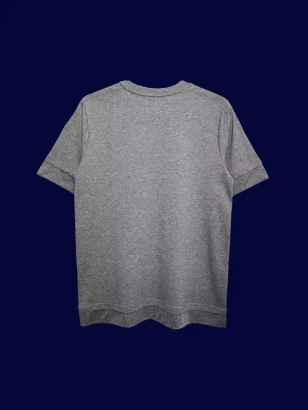 back view of grey away retro football jersey (15/16) showing plain back and number area.