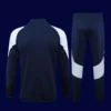Real Madrid Black Tracksuit 2425B - kfcool.com back view of black tracksuit top showing ventilation channels and tapered hem (24/25).