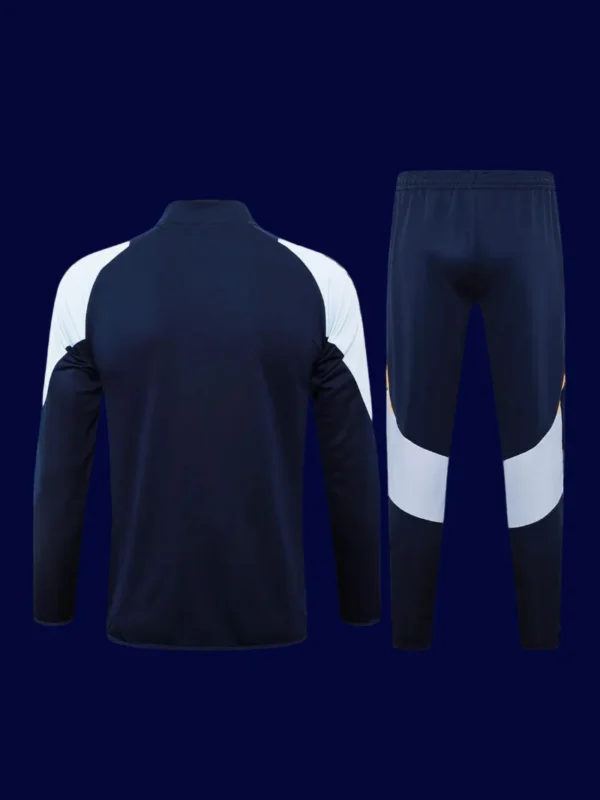 Real Madrid Black Tracksuit 2425B - kfcool.com back view of black tracksuit top showing ventilation channels and tapered hem (24/25).