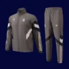 front view of grey windbreaker kit with zip and breathable lining (24/25).