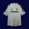 Real Madrid Home White Retro Jersey 0506A - kfcool.com front view of white home retro football jersey (05/06) with vintage collar and lightweight weave.