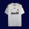 Real Madrid Home White Retro Jersey 0910A - kfcool.com front view of white home retro football jersey (09/10) with retro striping and V-neck.