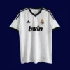 Real Madrid Home White Retro Jersey 1213A - kfcool.com front view of white home retro football jersey (12/13) with traditional collar and subtle piping.