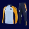 Real Madrid Tracksuit 2025A - kfcool.com front view of modern tracksuit top with tapered fit and full zip (2025).