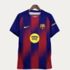Barcelona football jersey with blue and red vertical stripes on a hanger, featuring Nike swoosh, Spotify sponsor logo, and FC Barcelona crest.
