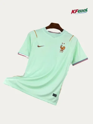 France Away Jersey 2627 Fans Version01 Mint green France national team soccer jersey on a hanger, featuring the FFF crest and Nike swoosh.
