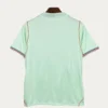 France Away Jersey 2627 Fans Version02 - KFCool – Football Jerseys & Soccer Kits Store Back view of a mint green short-sleeve soccer jersey with striped cuff edges and gold piping along the side seams; small collar and faint brand mark on the upper back.