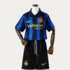 Inter Milan Home Kids kits 2627 Fans Version1 - KFCool – Football Jerseys & Soccer Kits Store Inter Milan blue-and-black striped soccer kit on a mannequin, featuring Betsson sponsor, Inter crest with two stars, and a yellow Nike logo.