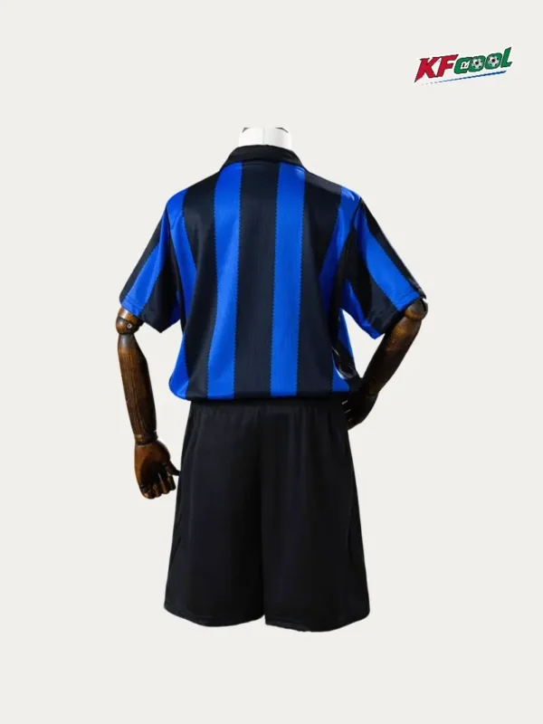 Inter Milan Home Kids kits 2627 Fans Version2 - KFCool – Football Jerseys & Soccer Kits Store Back view of a blue and black striped soccer jersey paired with black shorts on a mannequin; KFcool logo appears in the top-right corner.