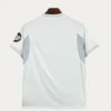 Real Madrid Home White Jersey 2526 Fans Version02 - KFCool – Football Jerseys & Soccer Kits Store Back view of a white athletic jersey with light gray side panels and ribbed sleeves; a circular logo on the left sleeve.