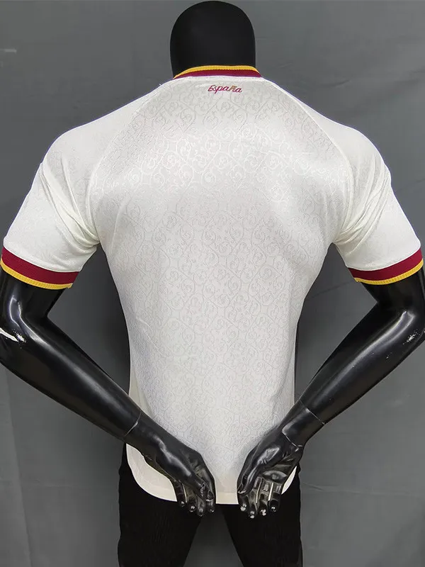 Back view of a white textured athletic jersey on a mannequin, with red and yellow trim on sleeves and collar and a small España logo at the neck.