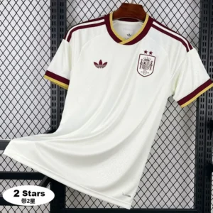 3a6f7ae579316710 White Spain national team soccer jersey on a hanger, features maroon and gold trim, crest on the left chest and Adidas logo on the right, with two stars above the crest and a '2 Stars' badge in the corner.