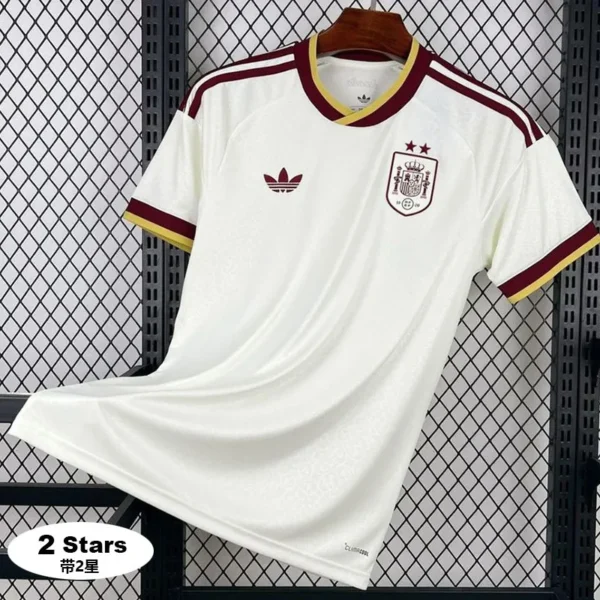 3a6f7ae579316710 - KFCool – Football Jerseys & Soccer Kits Store White Spain national team soccer jersey on a hanger, features maroon and gold trim, crest on the left chest and Adidas logo on the right, with two stars above the crest and a '2 Stars' badge in the corner.