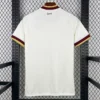4f3bfd4cc995804f - KFCool – Football Jerseys & Soccer Kits Store Back view of a white soccer jersey hanging on a rack, with maroon and gold trim on cuffs and collar; small 'España' text near the neck.