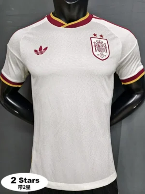 74a02c6c409847f3 White Spain national team football jersey on a mannequin with red-yellow trim, Adidas logo left chest, Spain crest with two stars on the right chest, 2 Stars badge visible in bottom-left corner
