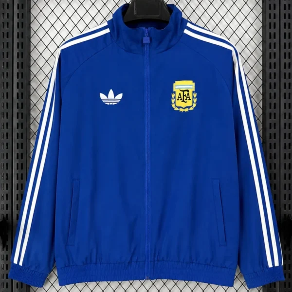Blue Adidas track jacket with white stripes down sleeves and zip front, displayed against a mesh background; features a white trefoil logo on the left chest and a yellow AFA crest on the right chest.