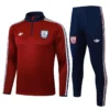 Arsenal 2025/26 Red White Half Pull Tracksuit - Front View - KFCool – Football Jerseys & Soccer Kits Store Arsenal training suit: red long-sleeve top with navy collar and white stripes, paired with navy pants featuring Arsenal crest.