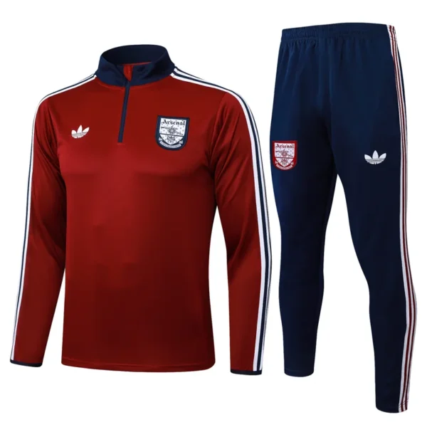 Arsenal 2025/26 Red White Half Pull Tracksuit - Front View - KFCool – Football Jerseys & Soccer Kits Store Arsenal training suit: red long-sleeve top with navy collar and white stripes, paired with navy pants featuring Arsenal crest.