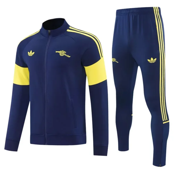 Arsenal 2026/27 Royal Blue Jacket Tracksuit - Front View - KFCool – Football Jerseys & Soccer Kits Store Navy blue tracksuit with yellow accents: zip-up jacket with yellow shoulder stripes and arm bands, matching pants with side stripes and logos.