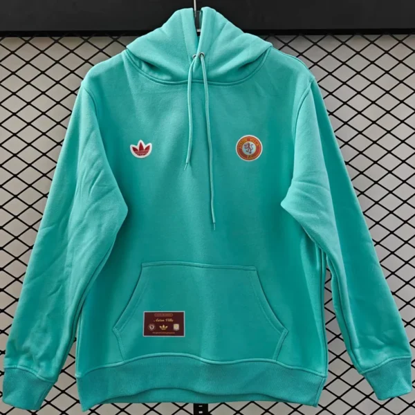 Turquoise hoodie on a hanger with an Adidas trefoil logo on the left chest and a circular patch on the right.