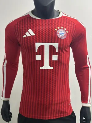 Bayern Munich 2026/27 Home Long Sleeve Jersey Player Version - Front View Red FC Bayern Munich long-sleeve soccer jersey on a mannequin, with Adidas logo on the chest, Bayern crest, and large white Telekom sponsor in the center.